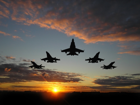 chips:  War and Peace, Jet fighters fly formation through sunset.